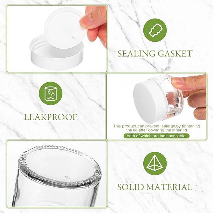 Domensi 100 Pcs 1 oz Glass Jars with Lids Bulk Round Glass Cosmetic Jars for DIY Lip Balm Small Travel Containers with Inner Liner for Lotions Powders Ointments Sample Cream(Clear, White)